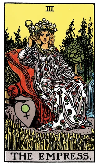 The Empress Rider-Waite-Smith tarot card showing a crowned woman seated among wheat, trees and flowing water.